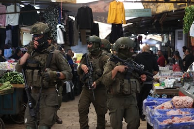 Israeli soldiers storm the market in the Old City of Nablus. EPA