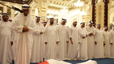 Sheikh Mohammad bin Rashid prays with Sheikh Mohammed bin Zayed, Crown Prince of Abu Dhabi and Deputy Supreme Commander of the Armed Forces, Sheikh Hamdan bin Mohammed, the Crown Prince of Dubai, and Rulers of the emirates over the body of his son Sheikh Rashid bin Mohammed during his funeral at Zabeel Mosque in Dubai. AFP Photo