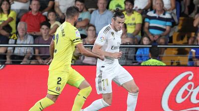 Real Madrid's Gareth Bale, right, controls the ball past Villareal's Mario Gaspar during the Spanish La Liga soccer match between Villarreal and Real Madrid in the Ceramica stadium in Villarreal, Spain. AP