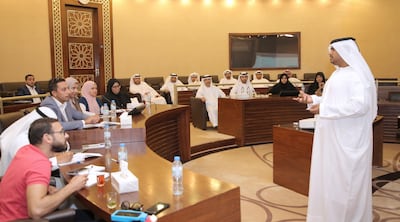 Khalid Al Shamsi, of Abu Dhabi Judicial Department, explains the workings of the electronic tag. Courtesy of the Abu Dhabu Judicial Department.