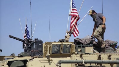 A US soldier stands on an armoured vehicle in the Syrian border village of Darbasiyah in this still from video filmed on April 29, 2017. AP Photo via APTV