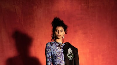 Osman Yousefzada's autumn / winter 2021 collection offers a swirling catsuit and a jacket adorned with the Hand of Fatima
