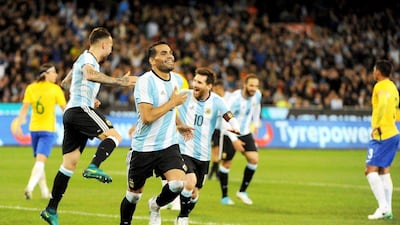 Gabriel Mercado of Argentina celebrates with his teammates after scoring against Brazil at the MCG in Melbourne, Australia. EPA