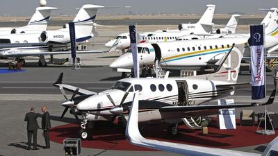 Aircraft line the runway at a business travel trade show at Al Maktoum International Airport in Dubai last year. Demand for private jets is rising in the GCC as economies thrive and wealth grows. Jeff Topping / The National