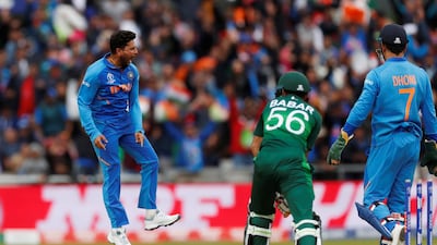 India bowler Kuldeep Yadav celebrates the wicket of Pakistan's Babar Azam during the Cricket World Cup match at Old Trafford. Reuters