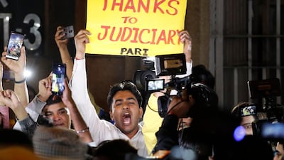 A man celebrates outside Tijhar jail as the convicted rapists are hanged. AP Photo