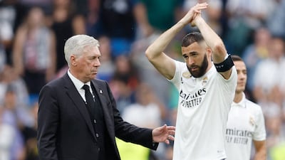 Real Madrid's Karim Benzema applauds fans after the match with coach Carlo Ancelotti. Reuters