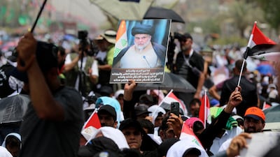 Followers of Shiite cleric Moqtada Al Sadr during open-air Friday prayers in Sadr City, Baghdad, on July 15, 2022. AP