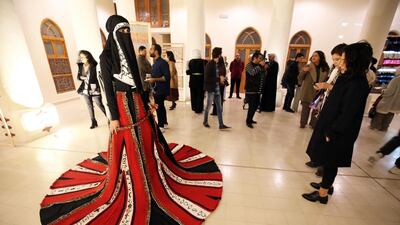A model displays a dress by Kuwaiti designer Abdullah Al-Saleh at a gallery in Kuwait City. AFP