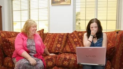 Niamh Merrigan, 16, is jubilant after receiving her GCSE results, as her equally happy mother Donna looks on in their villa at Umm Suqeim, Dubai.