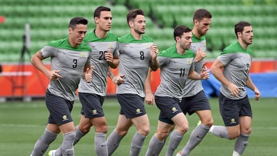 Australia players jog during their final training session ahead of the Asian Cup in Melbourne on January 8, 2015. William West / AFP