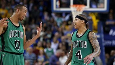 Isaiah Thomas, right, and Avery Bradley of the Boston Celtics smile during their NBA win over the Golden State Warriors on Friday night. Ezra Shaw / Getty Images / AFP / April 1, 2016