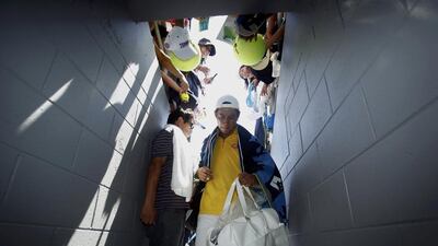 Kei Nishikori of Japan leaves after defeating Marinko Matosevic of Australia. Jason Reed / Reuters