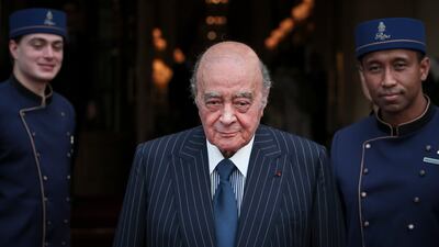 Mohamed Al-Fayed with his hotel staff in Paris. AP