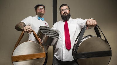 Goats Don’t Shave partners Jesper Wiren, left, and Pieter-Jan van Linden display their portable stainless steel barbeque called The Square, a unit they have created especially to withstand the UAE heat and to promote friendship. Antonie Robertson / The National