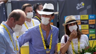 Race director Christian Prudhomme, left, speaks with Danish Prince Joachim and his wife Princess Marie. AP