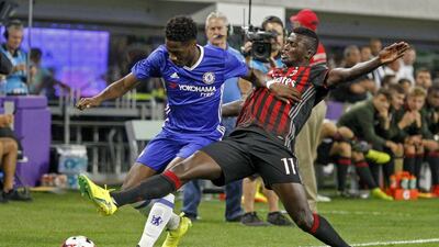 Chelsea’s Ola Aina, left, battles with AC Milan’s Niang Mbaye for the ball. Bruce Kluckhohn / AP Photo