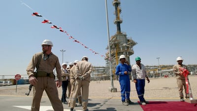 Security personnel guard Exxon's staff of the West Qurna-1 oilfield. Reuters