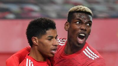 Rashford celebrates with Paul Pogba. EPA