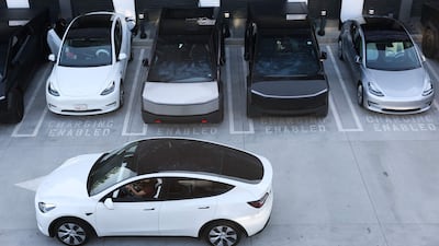 Tesla electric vehicles charge at stations in Los Angeles, California. AFP