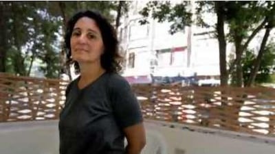 "We have allowed ourselves to sort ourselves, to reclassify people into included and excluded": Nadia Kamel poses on the balcony of her Cairo apartment.