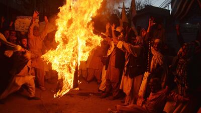 A US flag is burnt during an anti-US protest in Quetta, Pakistan. Pakistan has summoned the US ambassador to explain a tweet by Mr Trump that said the United States had been foolish in dispensing aid to Islamabad.JAMAL TARAQAI