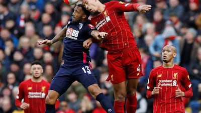 Liverpool's Virgil van Dijk takes on Bournemouth's Callum Wilson. Reuters