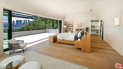 A bedroom wall opens up to give a view across the city