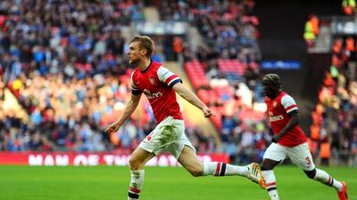 Per Mertesacker, the Arsenal defender, scored the equaliser in the FA Cup semi-final against Wigan Athletic on Saturday. Mike Hewitt / Getty Images