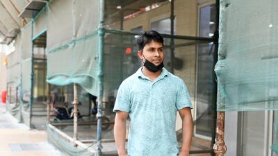Mustafa Al Haqq, 33, originally from Bangladesh works as a watchman in Tourist Club Area for the last 11 years. Khushnum Bhandari for The National