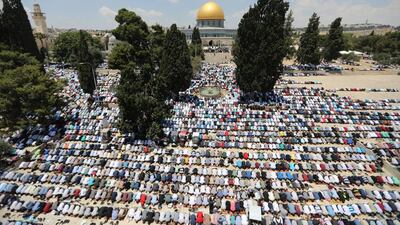 Palestinian Muslims pray on the first Friday of Ramadan before what Muslims call Noble Sanctuary in the Al Aqsa complex in the Old City of Jerusalem on June 2, 2017. Ammar Awad / Reuters