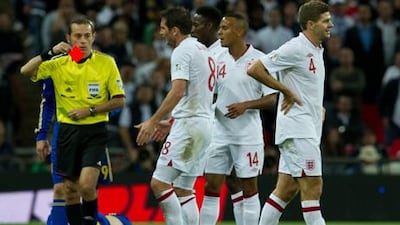England captain Steven Gerrard leaves the pitch after being red carded for a foul on Denys Harmash during England's World Cup qualifier against Ukraine