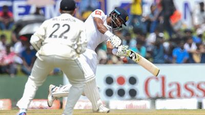 Dimuth Karunaratne, right, scored the ninth century of his Test career as victorious Sri Lanka collected their first world championshippoints. Ishara S Kodikara / AFP