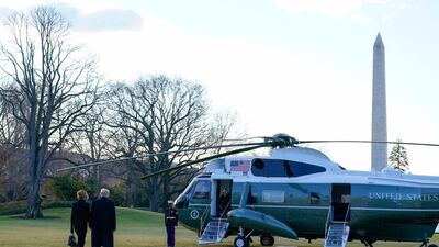 President Donald Trump and first lady Melania Trump walk to board Marine One on the South Lawn of the White House. AP Photo