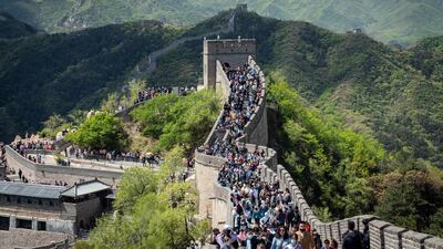 Visitors walk along the Badaling section of the Great Wall in Beijing, China. Bloomberg