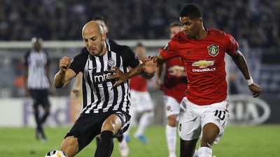 Nemanja Miletic, left, is challenged by Marcus Rashford at the Partizan Stadium in Belgrade. Getty Images