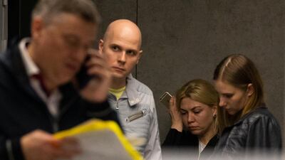 Relatives wait for news of passengers onboard an Aeroflot plane that was engulfed by a fire after making an emergency landing at Sheremetyevo International Airport in Moscow. AP Photo