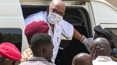 Sudan's ousted President Omar al-Bashir disembarking from a vehicle upon arriving at the courthouse to attend his trial along with 27 other co-accused, in the capital Khartoum. AFP