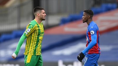 Wilfried Zaha, right, of Crystal Palace argues with Okay Yokuslu of West Brom. AP