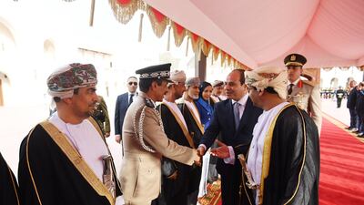 Mr El Sisi greets Omani officials.
