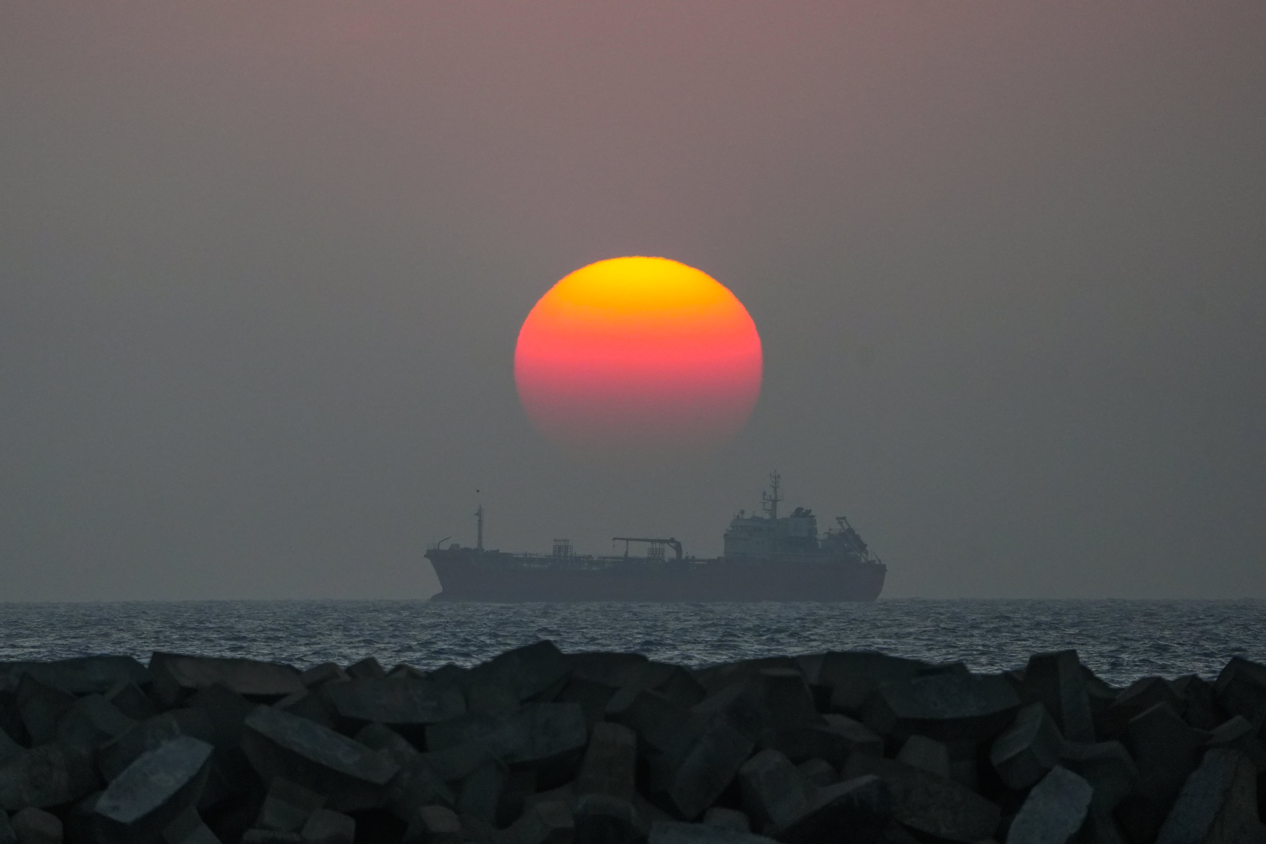 An oil tanker is moving on the sea at sunset in Colombo, Sri Lanka, on January 25, 2024. AFP
