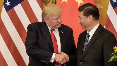 US president Donald Trump shakes hand with Chinese president Xi Jinping at the end of a press conference at the Great Hall of the People in Beijing on November 9, 2017. Fred Dufour / AFP