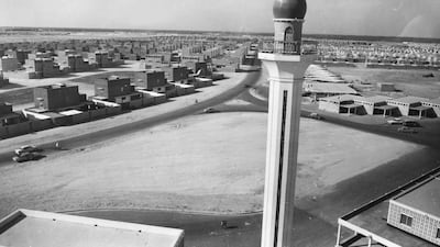 A mosque and rows of identical square houses in Isa Town, as the new town nears completion in 1968.