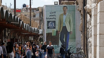 A poster of President Bashar Al Assad near the Grand Umayyad Mosque in Damascus. AFP
