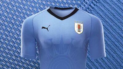 7 Uruguay || The look: Uruguay enters the World Cup sporting their classic silver-blue strip from Puma. It looks plain, but it's the little details that make this shirt pop: the Atlantic sun graphic, a hashtag, the black trim. || Would I wear it? I'm sadly not Edison Cavani