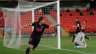 Real Madrid's Luka Modric celebrates scoring their first goal against Granada on Thursday. Reuters