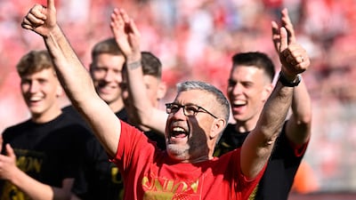 Union Berlin manager Urs Fischer celebrates after the Bundesliga win over Werder Bremen that sealed the club's Champions League spot for next season. AFP