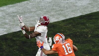 Daylon Charlot #4 of the Alabama Crimson Tide misses a catch in the fourth quarter against Jordan Leggett #16 of the Clemson Tigers during the 2016 College Football Playoff National Championship Game at University of Phoenix Stadium on January 11, 2016 in Glendale, Arizona. Norm Hall/Getty Images/AFP