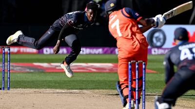 Namibia's Ben Shikongo bowls to Netherlands' Vikram Singh. AFP