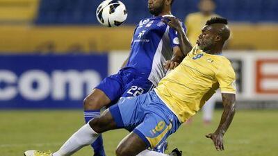 Djibril Cisse of Al Gharafa fights for the ball with Mahmoud Darwish. Fadi Al-Assaad / Reuters